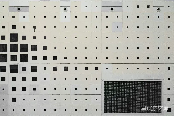 高清摄影 一堵白色墙上有黑色的方块和点。