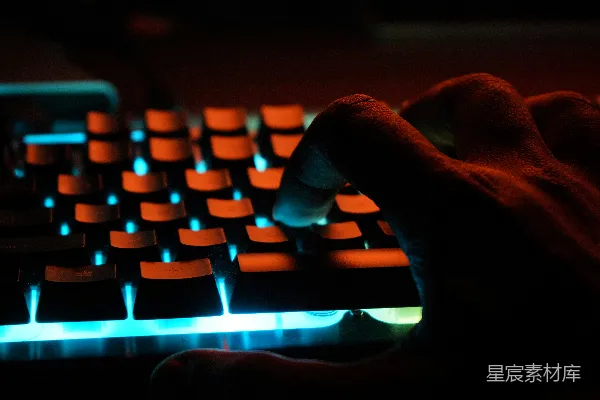 高清摄影 人手在蓝色发光的电脑键盘上