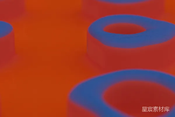 高清摄影 一组蓝色和红色的物体放在橙色的表面上。