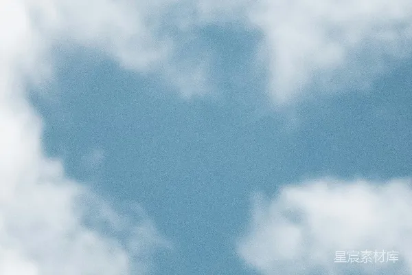 高清摄影 一只鸟在天空中飞翔，背景有一朵云。