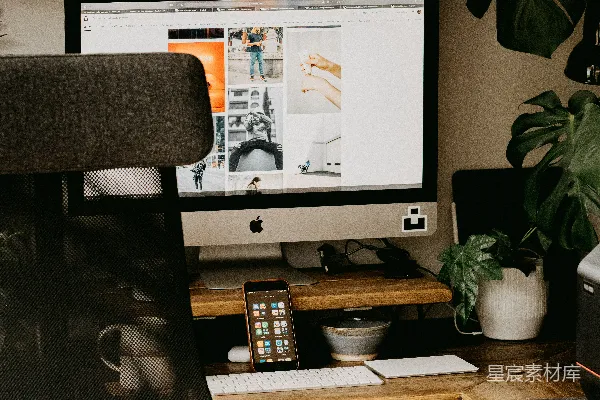高清摄影 银色的iMac放在棕色的木桌上