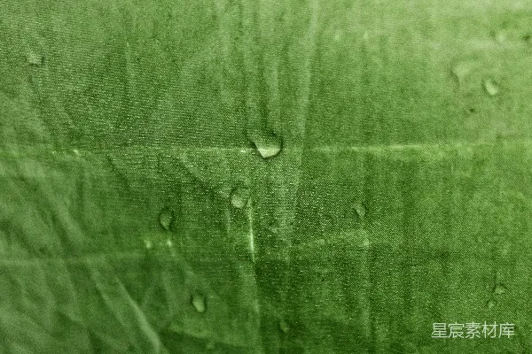 高清摄影 一张上面有水滴的绿色布料