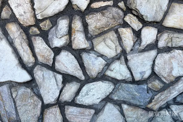 高清摄影 不规则的天然石头用黑色的水泥浆粘合在一起