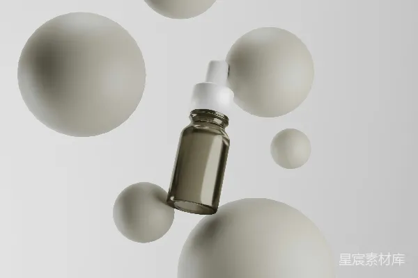 高清摄影 一瓶精华液悬停在球体之间。