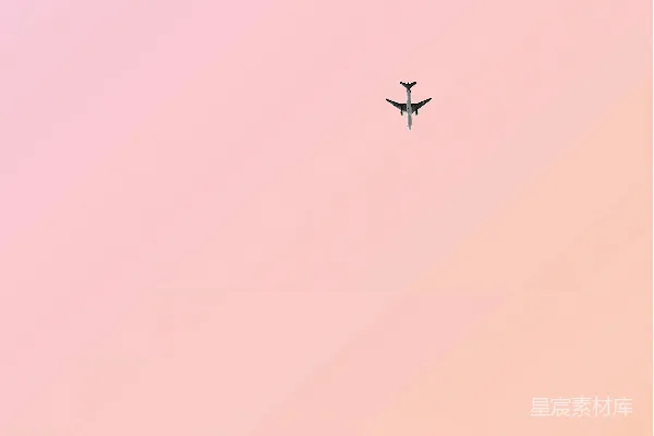高清摄影 粉色天空中飞行的飞机