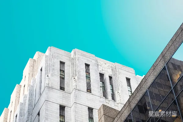 高清摄影 灰白色的混凝土建筑在蓝天背景下