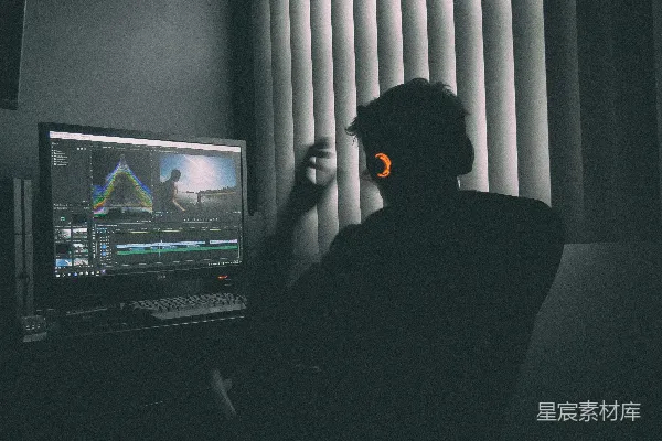 高清摄影 浅景深摄影，一个人在电脑前听音乐。